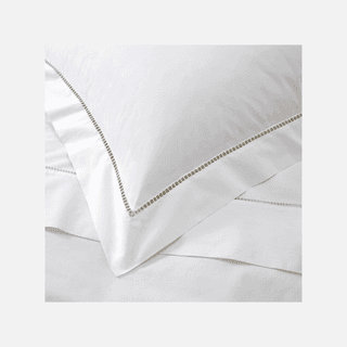 Image may contain Cushion Home Decor Pillow Linen Accessories Jewelry and Necklace
